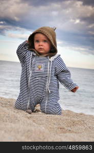 Portrait of a toddler in a sandy beach