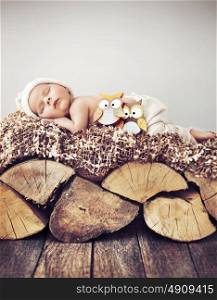 Portrait of a toddler sleeping on wood