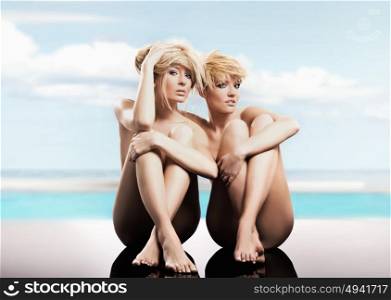 Portrait of a two beautiful, blond girlfriends