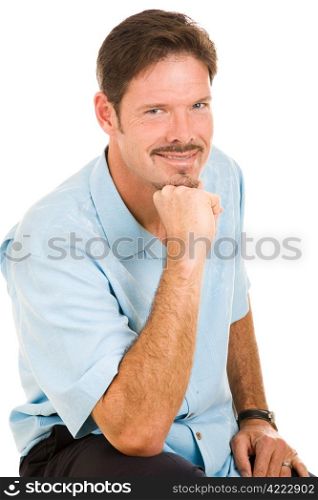 Portrait of a very handsome man with a playfully roguish grin. Isolated on white.