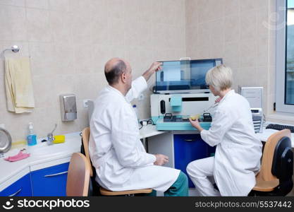 portrait of a veterinarian and assistant in a small animal clinic at work