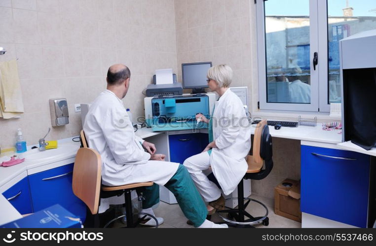 portrait of a veterinarian and assistant in a small animal clinic at work