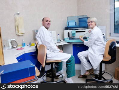 portrait of a veterinarian and assistant in a small animal clinic at work