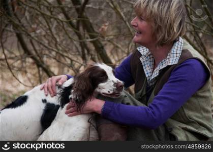 Portrait of a woman and her two spaniels