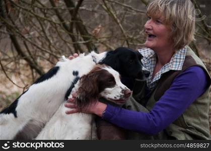 Portrait of a woman and her two spaniels