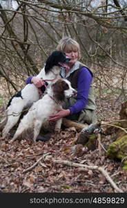 Portrait of a woman and her two spaniels