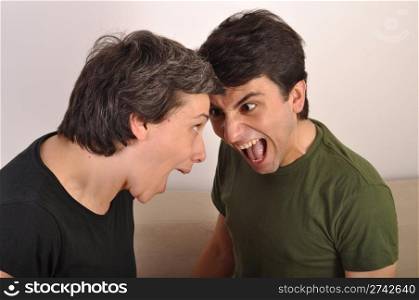 portrait of a woman and man yelling at each other