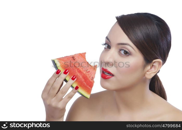 Portrait of a woman eating a watermelon