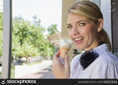 Portrait of a woman eating an ice cream