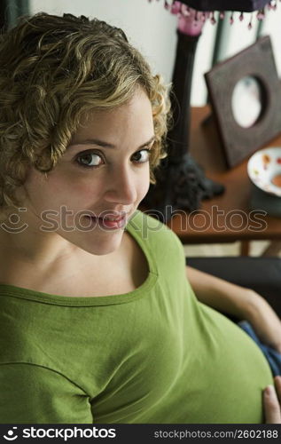 Portrait of a woman five months pregnant