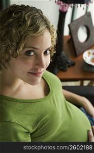 Portrait of a woman five months pregnant