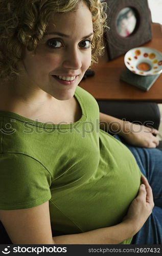 Portrait of a woman five months pregnant