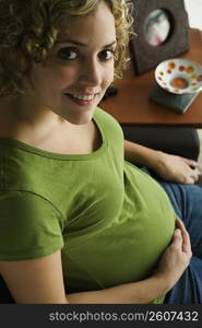 Portrait of a woman five months pregnant