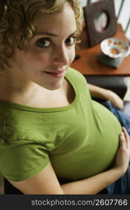 Portrait of a woman five months pregnant