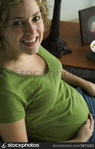 Portrait of a woman five months pregnant