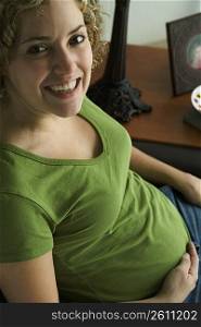 Portrait of a woman five months pregnant