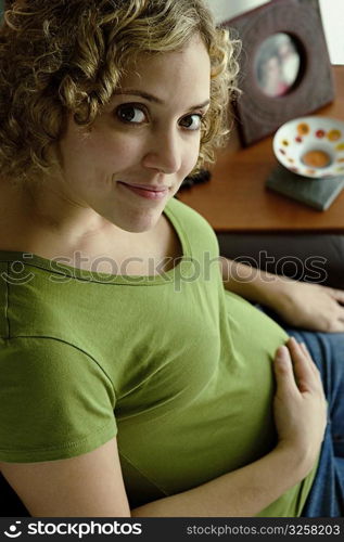 Portrait of a woman five months pregnant