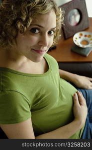 Portrait of a woman five months pregnant