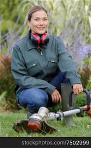 portrait of a woman gardening outdoors smiling