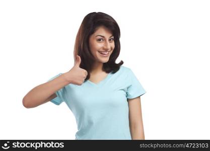 Portrait of a woman giving thumbs up