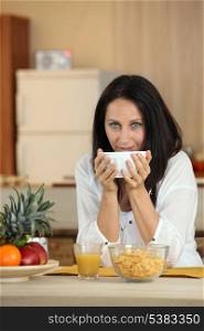 Portrait of a woman having breakfast