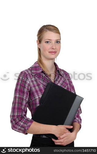 Portrait of a woman holding a folder