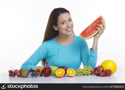 Portrait of a woman holding a watermelon
