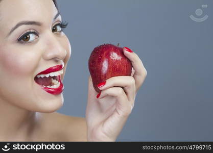 Portrait of a woman holding an apple