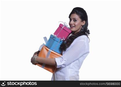 Portrait of a woman holding gift boxes