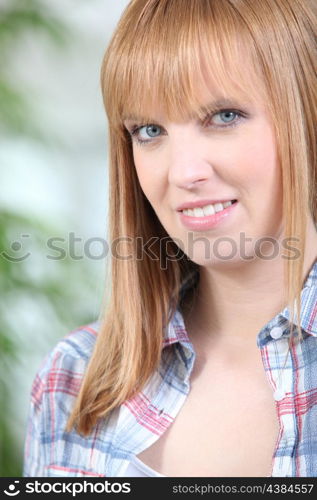 Portrait of a woman in a checked shirt