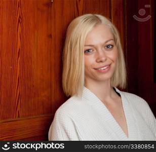 Portrait of a woman in an old wooden spa interior