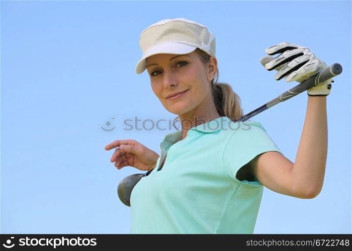 portrait of a woman in golf clothes