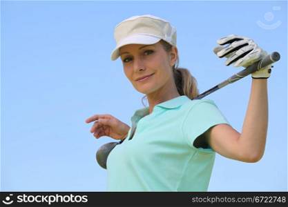 portrait of a woman in golf clothes