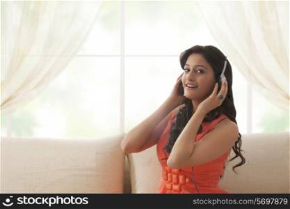 Portrait of a woman listening to music
