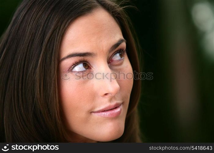 Portrait of a woman looking out of the corner of her eye