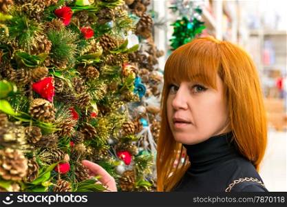 portrait of a woman near the Christmas fir