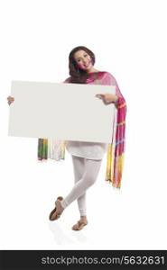 Portrait of a woman pointing to a white board