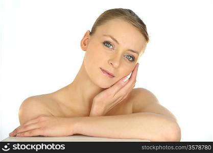Portrait of a woman stroking her face