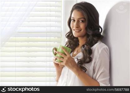 Portrait of a woman with a mug of tea