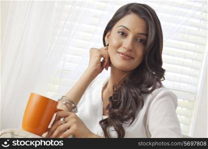 Portrait of a woman with a mug of tea