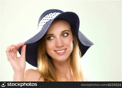 portrait of a woman with a summer hat. portrait of a woman with a summer hat on light green background
