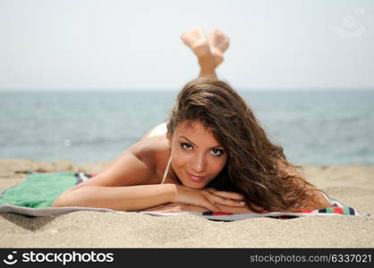 Portrait of a woman with beautiful body on a tropical beach