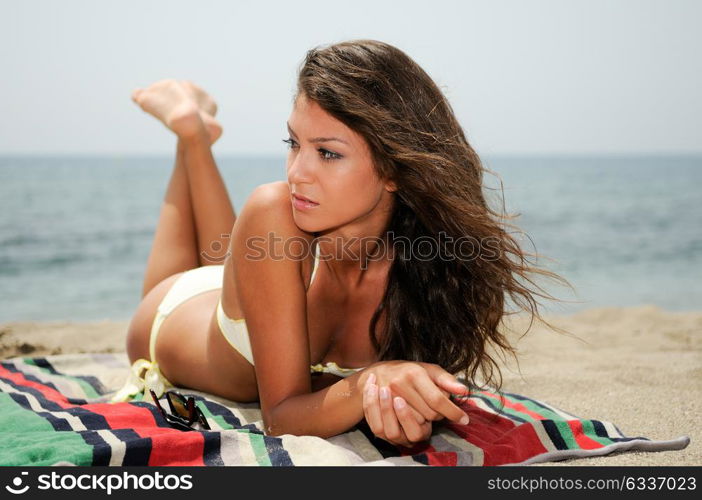 Portrait of a woman with beautiful body on a tropical beach