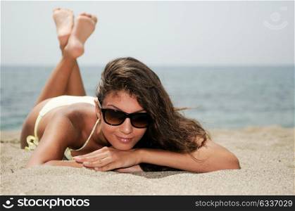 Portrait of a woman with beautiful body on a tropical beach
