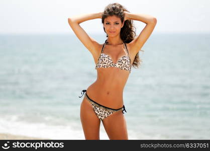 Portrait of a woman with beautiful body on a tropical beach