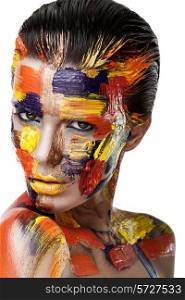 Portrait of a woman with colorful paint brushstroken on face