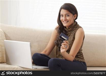 Portrait of a woman with credit card
