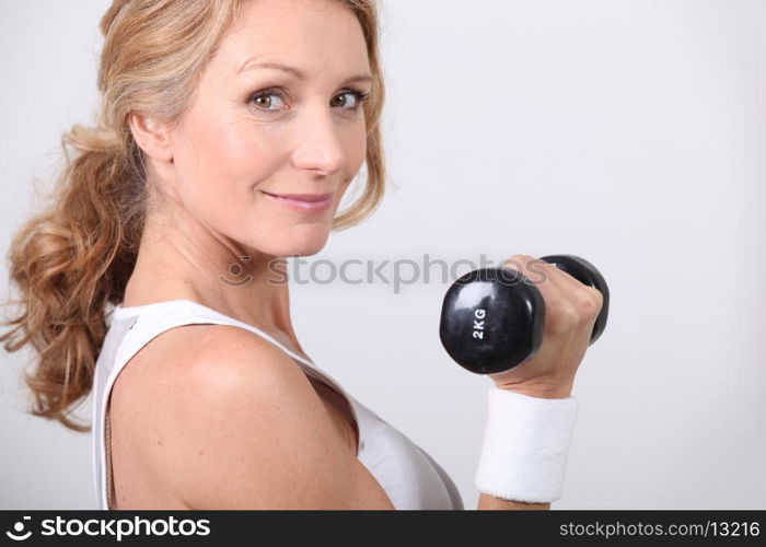 portrait of a woman with dumbbell