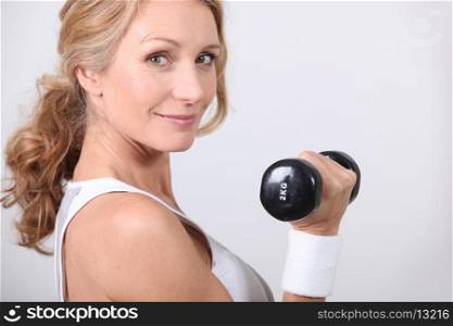 portrait of a woman with dumbbell