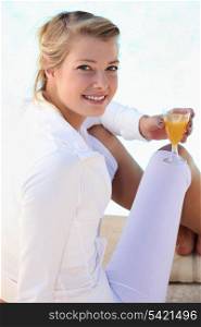 portrait of a woman with glass of orange juice